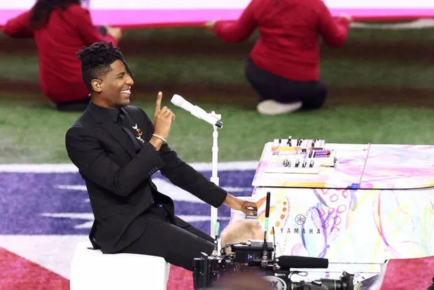 Jon Batiste performs the national anthem during Super Bowl 2025